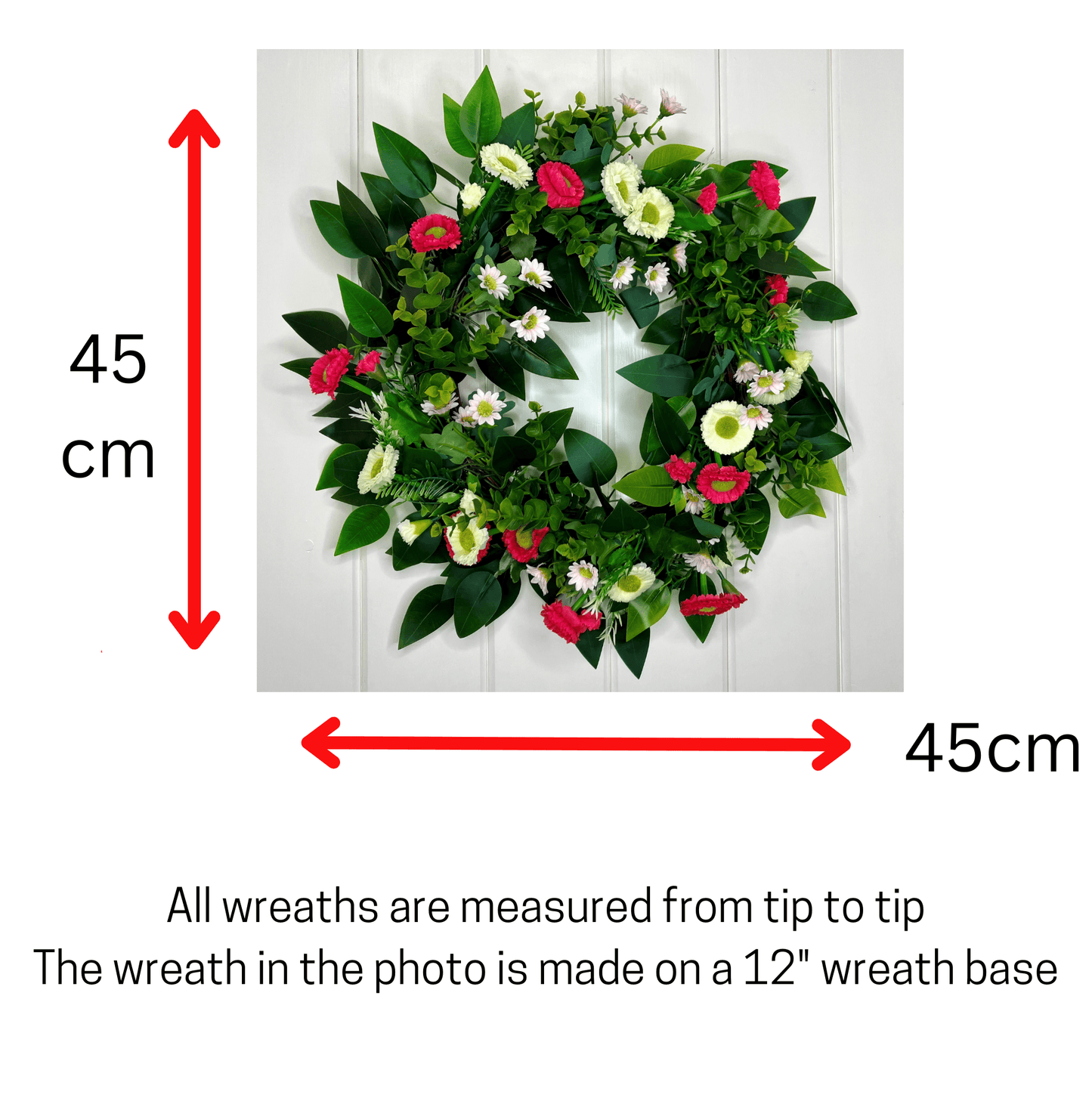 spring summer welcome door wreath with pink and white bellis daisies and greenery