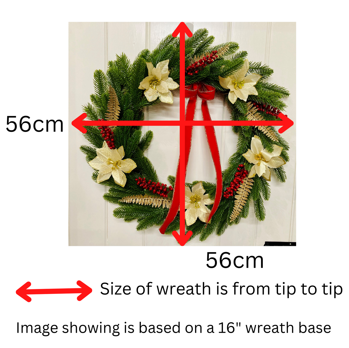 Christmas Wreath With Cream and Gold Poinsettias with Red Berries Presented On A Faux Pine Base