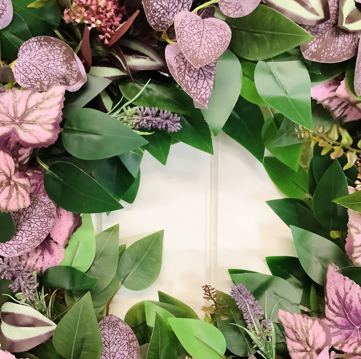 green ficus leaves, purple eucalyptus, mauve angel leaves, tradescantia leaves, autumn winter door wreath