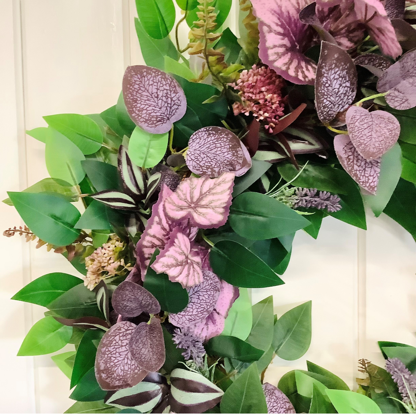 green ficus leaves, purple eucalyptus, mauve angel leaves, tradescantia leaves, autumn winter door wreath