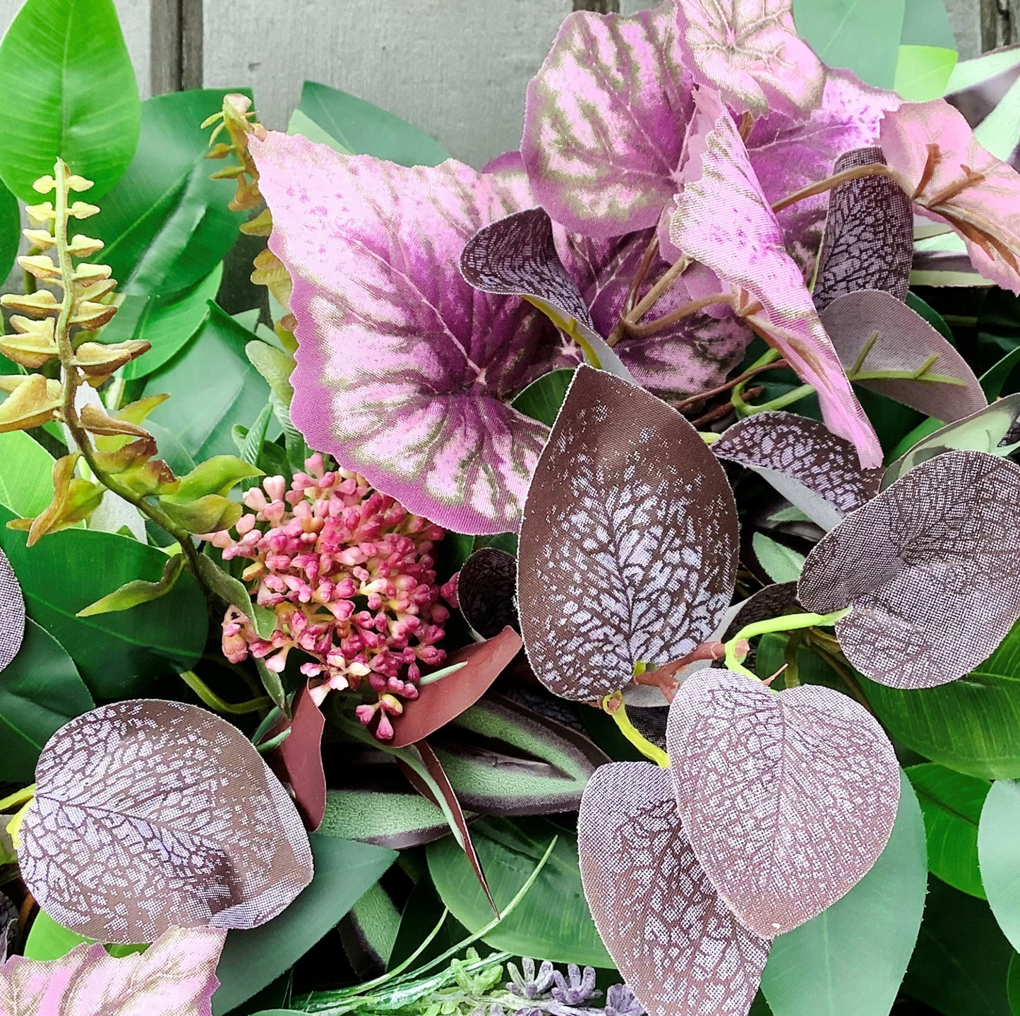 green ficus leaves, purple eucalyptus, mauve angel leaves, tradescantia leaves, autumn winter door wreath