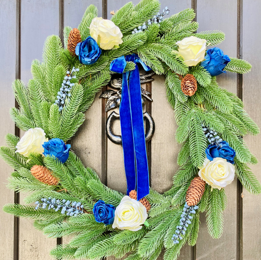 Christmas Wreath with Cream and Blue Roses, Blue Berries And Is Presented On Nordic Pine