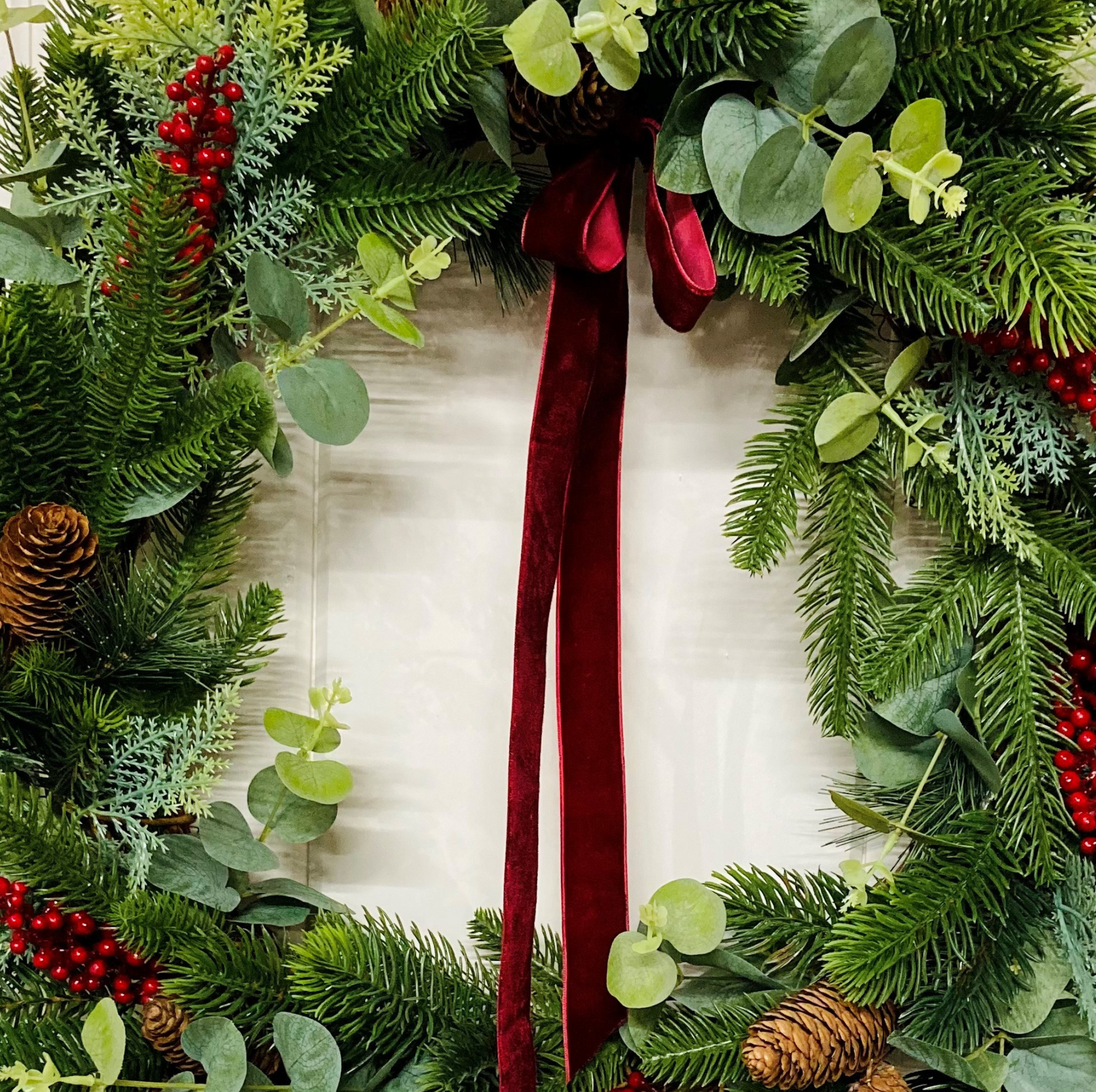 Christmas Wreath In A Traditional Style With Faux Berries, Pinecones and Pines