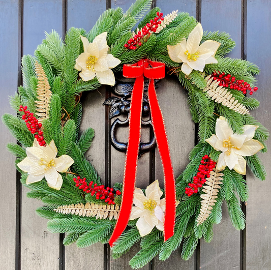 Christmas Wreath With Cream and Gold Poinsettias with Red Berries Presented On A Faux Pine Base