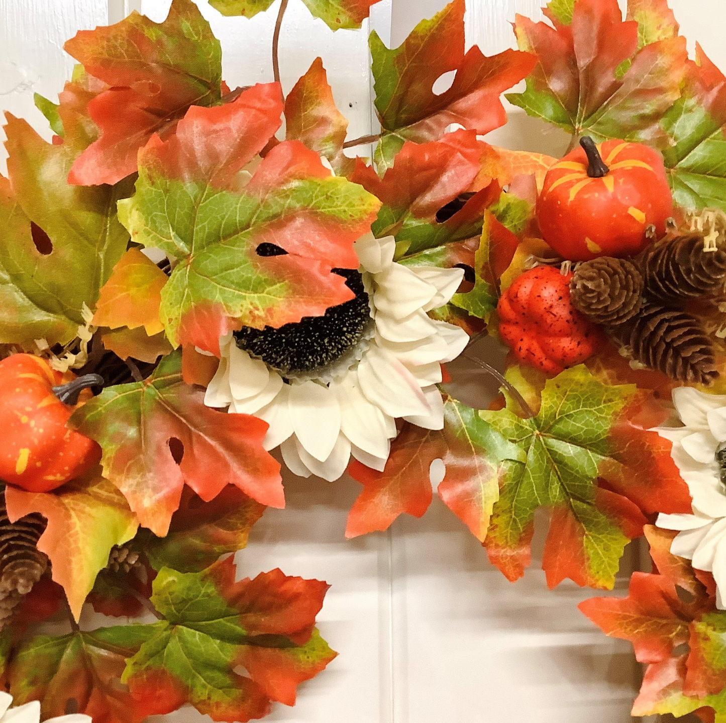 Cream Sunflowers with Pine Cones & Pumpkins set on Autumnal Coloured Crisp Red and Green Maple Leaves Door Wreath