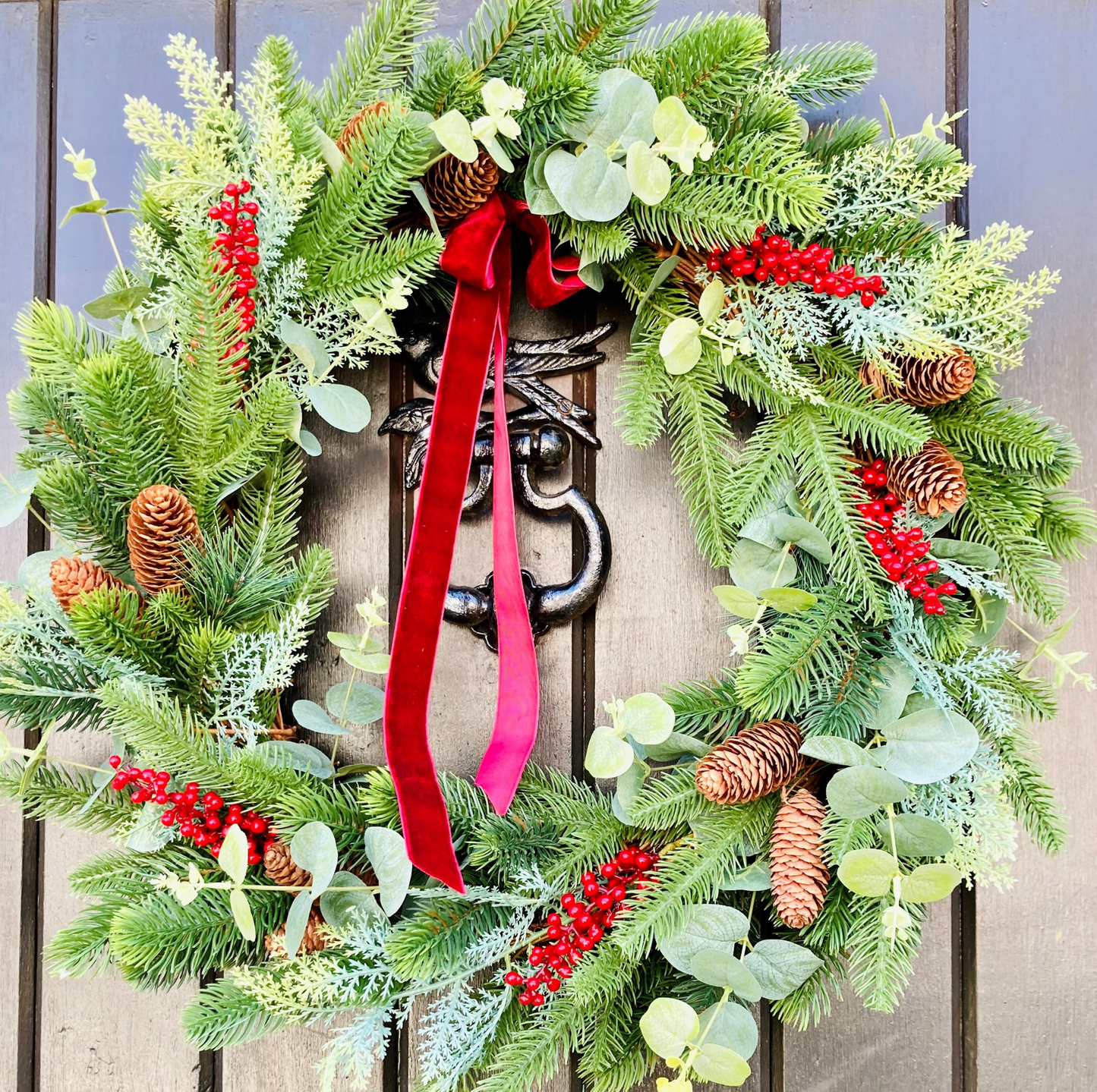 Christmas Wreath In A Traditional Style With Faux Berries, Pinecones and Pines