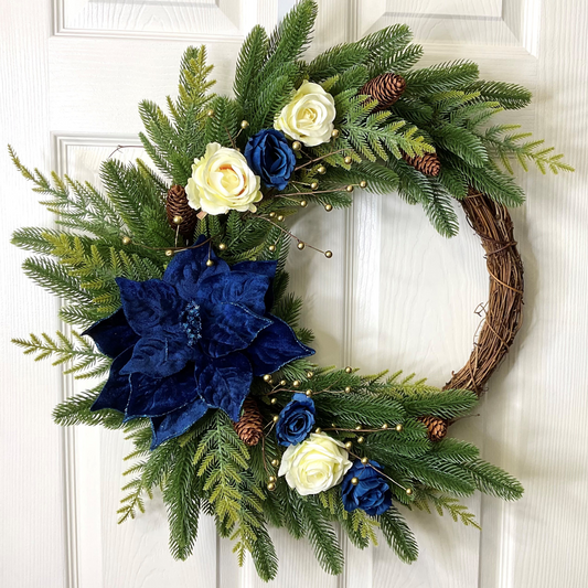 Crescent Style Christmas Wreath with a large Blue Poinsettia, Cream and Blue Roses, on a Pine Base