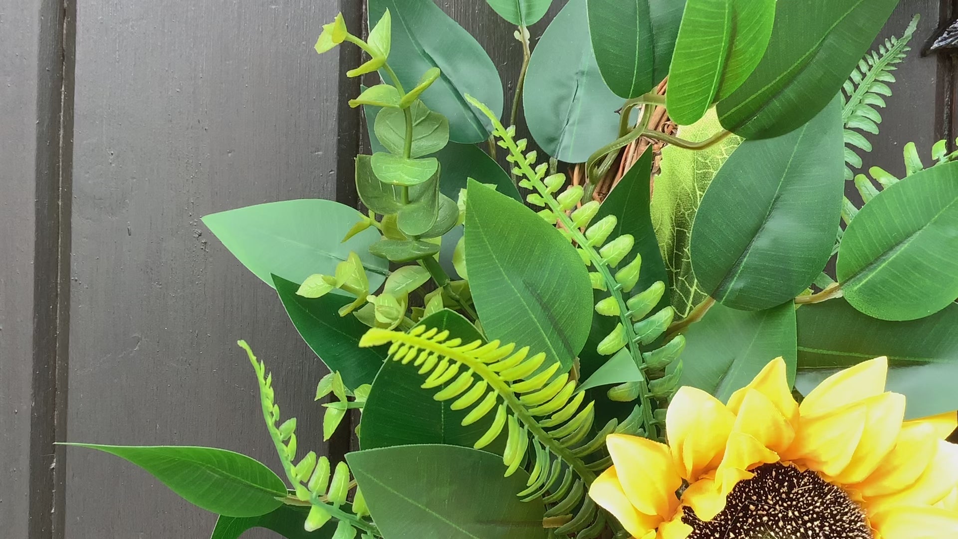 various sizes of bright yellow sunflower half style door wreath