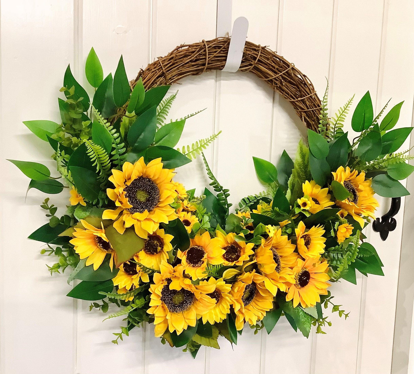 various sizes of bright yellow sunflower half style door wreath