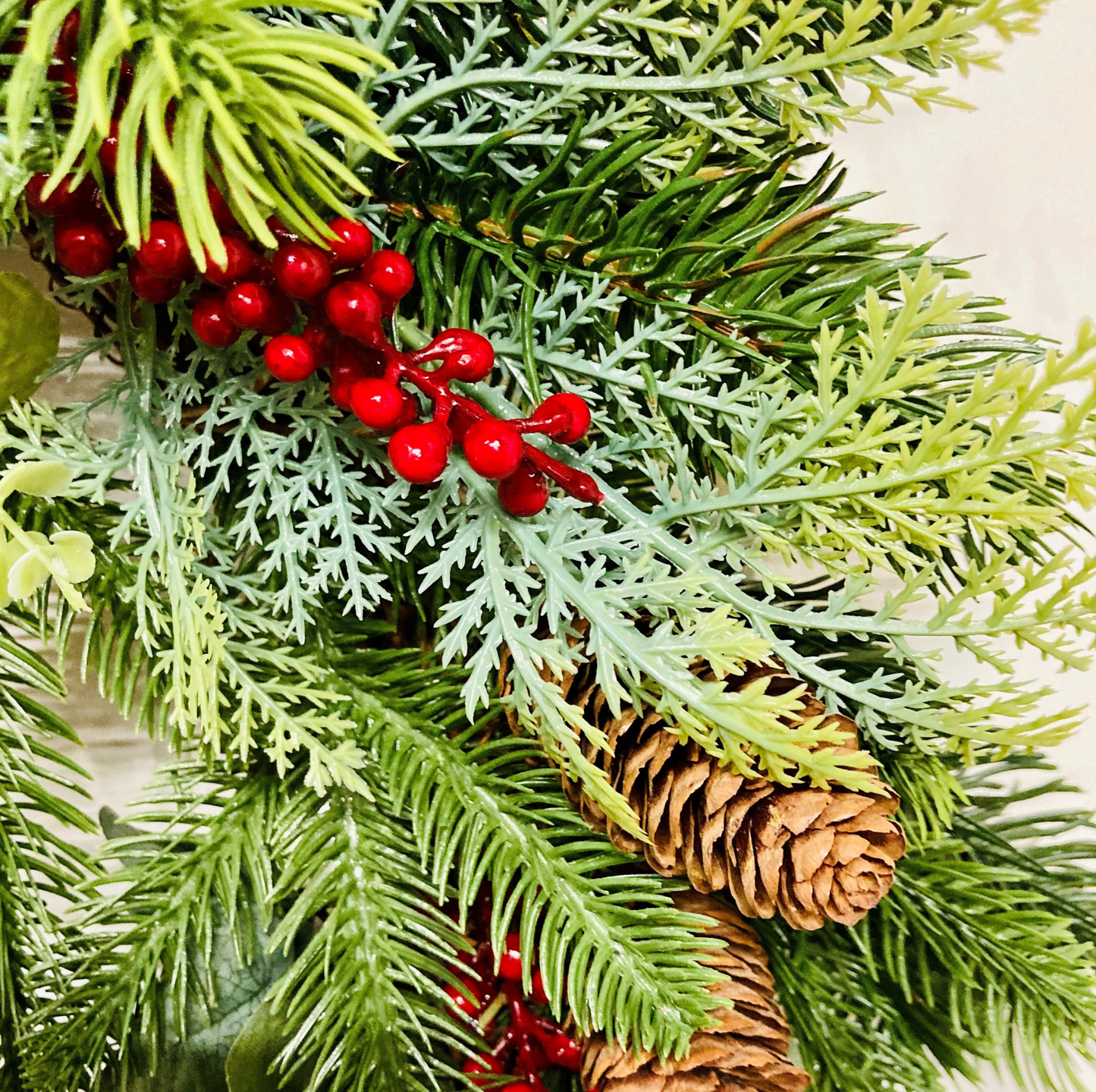 Christmas Wreath In A Traditional Style With Faux Berries, Pinecones and Pines