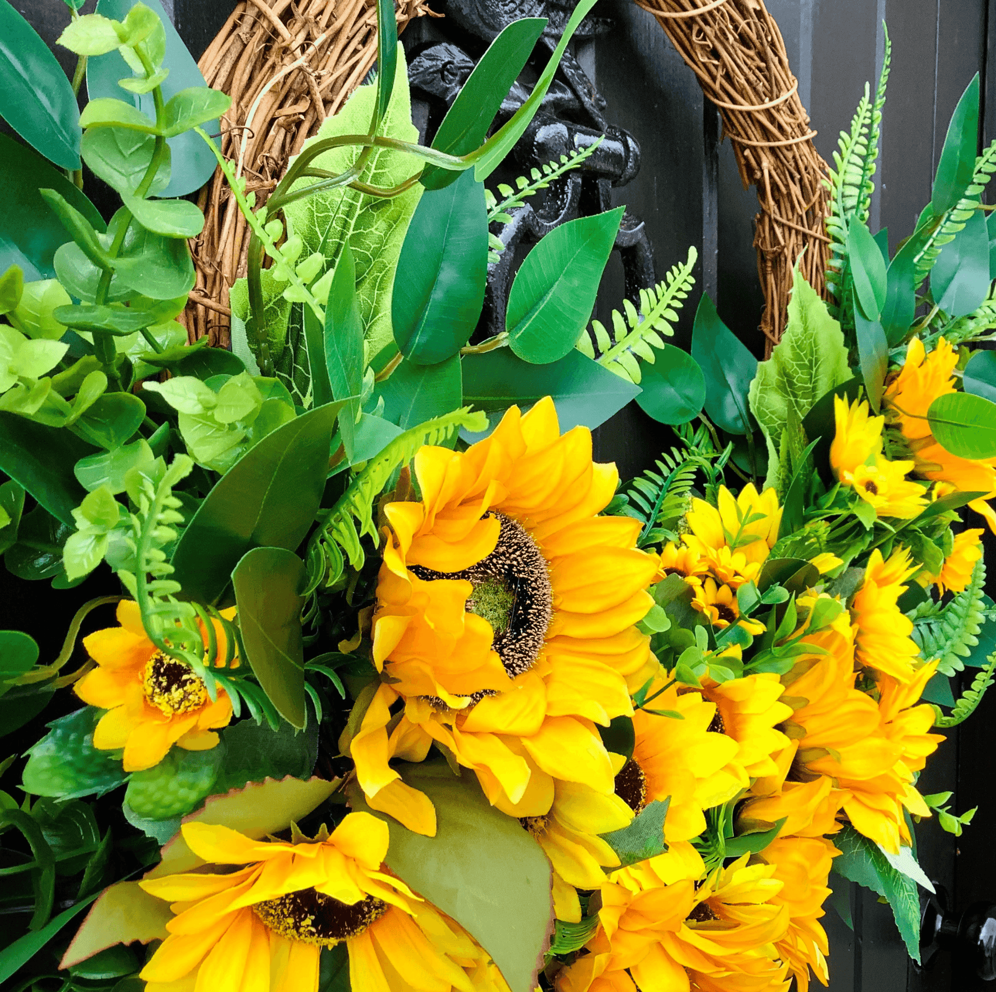 various sizes of bright yellow sunflower half style door wreath